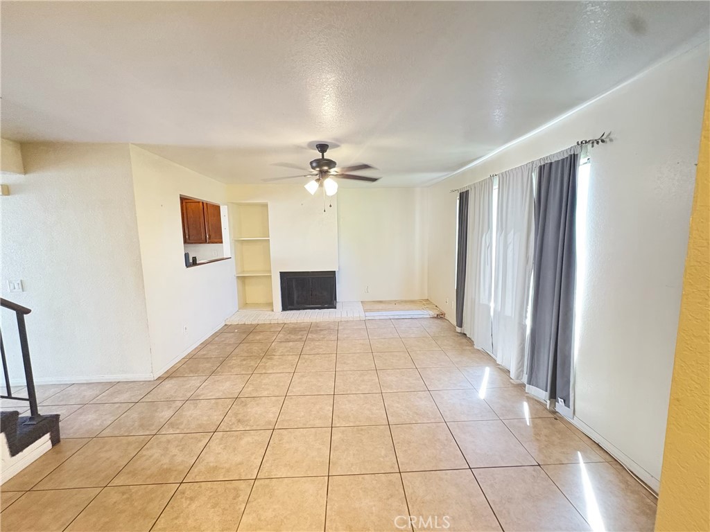 9727 Fremont Avenue Montclair, CA 91763 - Photo 2 of 10 a view of a livingroom with a staircase