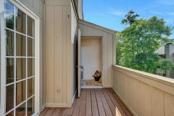 a white bath tub sitting next to a white wall