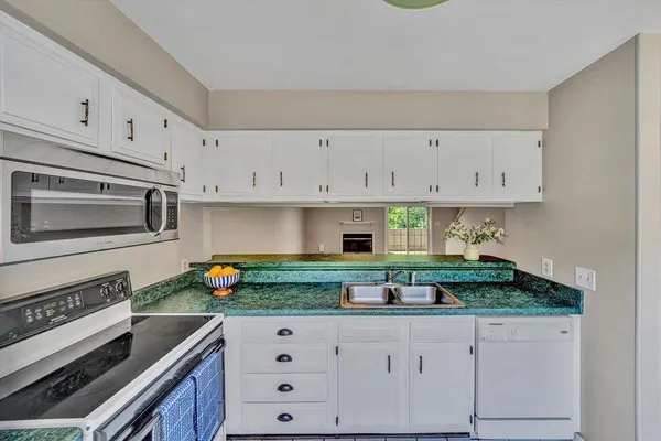a bathroom with a sink a mirror and a toilet