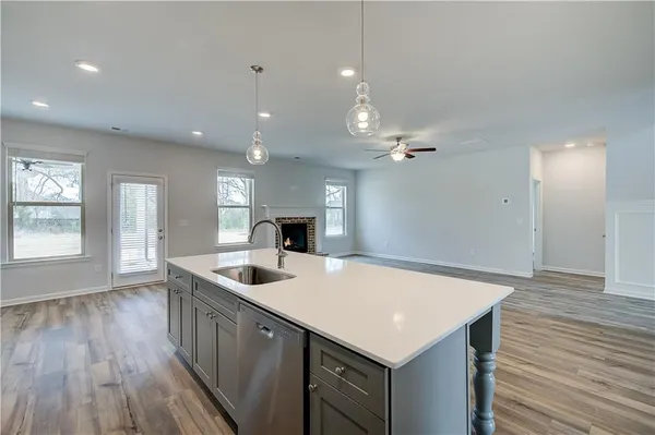 a kitchen with a sink a counter top space and appliances