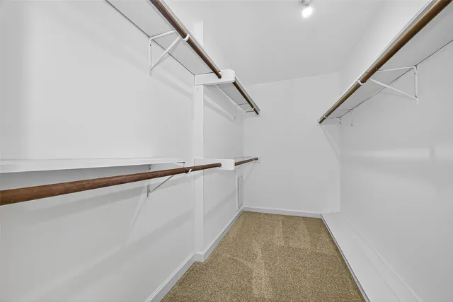 a view of a hallway with stairs