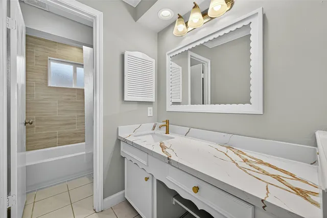 a bathroom with a sink a vanity and a mirror