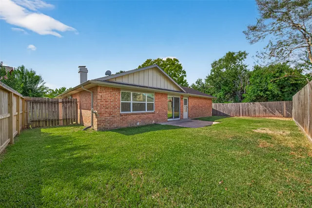 a backyard of a house with lots of green space