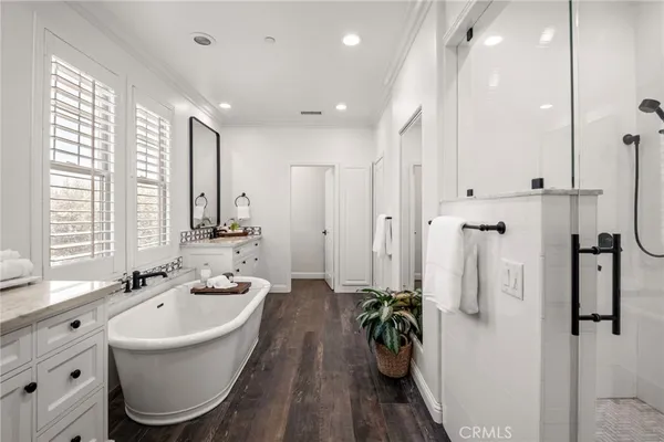 a bathroom with a toilet a sink and a window