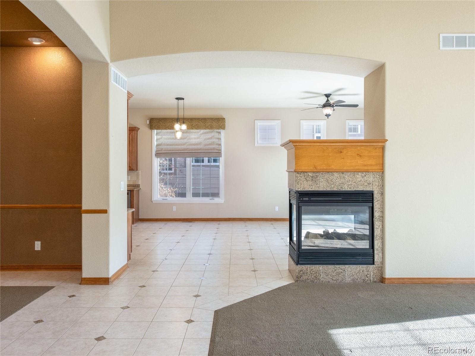 4940 West 107th Loop Westminster, CO 80031 - Photo 14 of 44 a view of an empty room and fire place