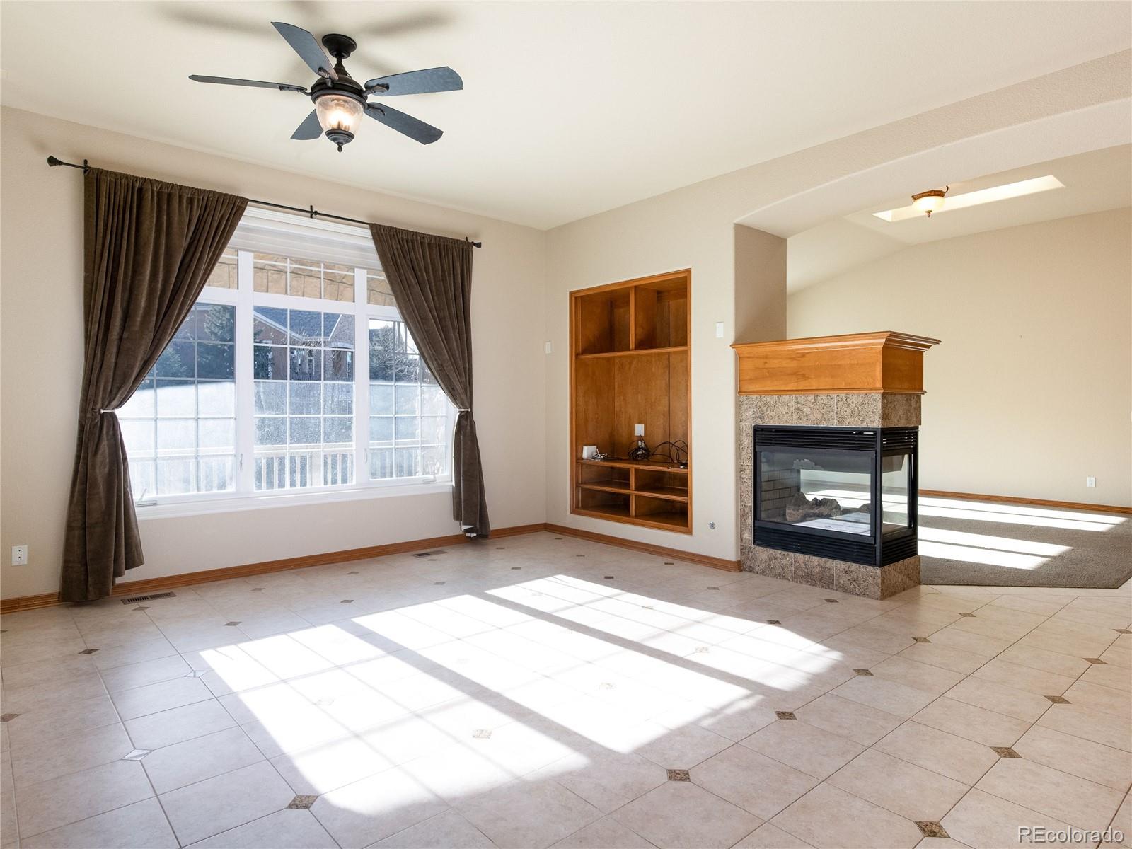 4940 West 107th Loop Westminster, CO 80031 - Photo 15 of 44 a view of livingroom with furniture and windows