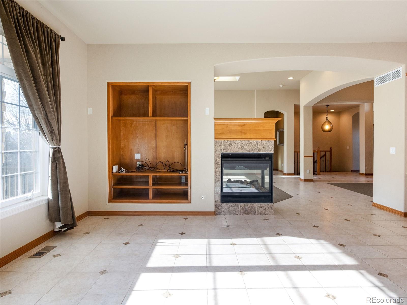 4940 West 107th Loop Westminster, CO 80031 - Photo 16 of 44 a window and a refrigerator in a hall