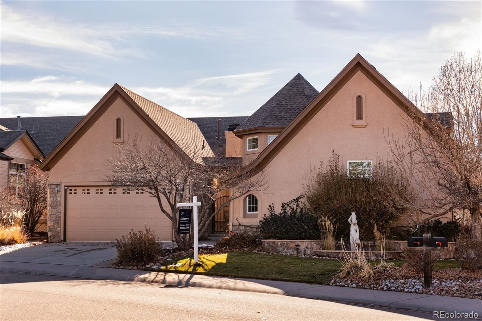 4940 West 107th Loop Westminster, CO 80031 - Photo 2 of 44 a front view of a house with garage