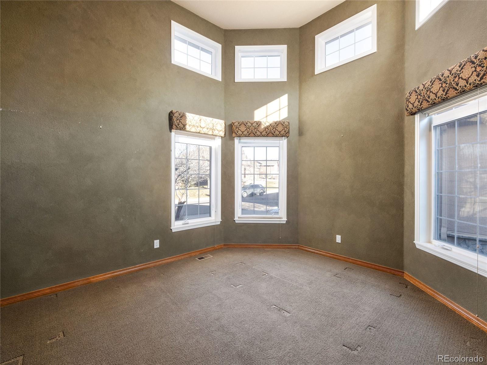 4940 West 107th Loop Westminster, CO 80031 - Photo 23 of 44 a view of an empty room with a window