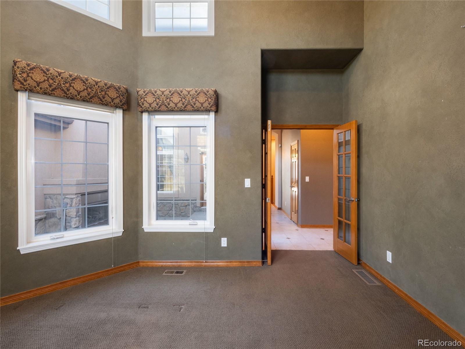 4940 West 107th Loop Westminster, CO 80031 - Photo 24 of 44 a view of an empty room with a window