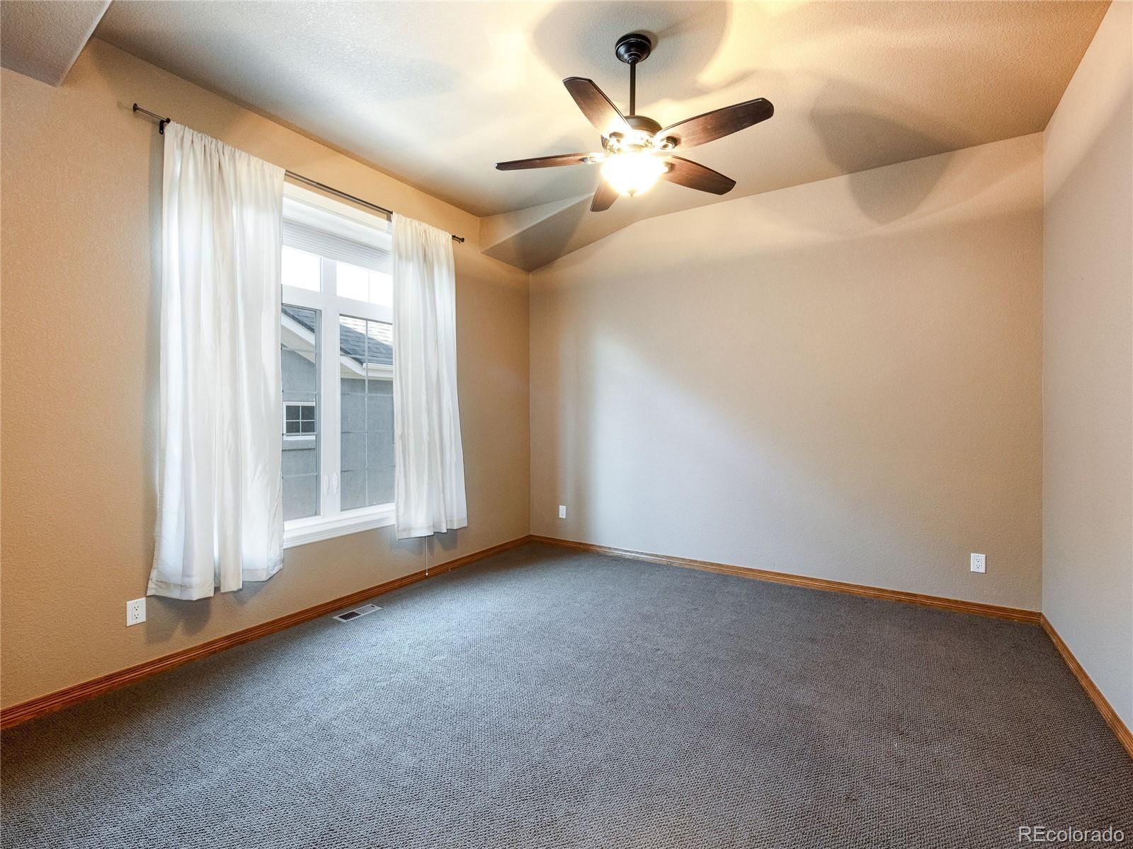 4940 West 107th Loop Westminster, CO 80031 - Photo 26 of 44 a view of an empty room with a window