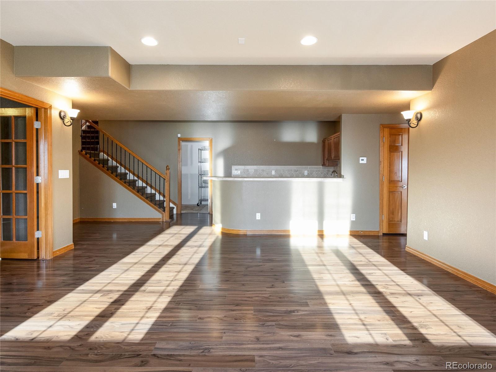 4940 West 107th Loop Westminster, CO 80031 - Photo 31 of 44 a view of a hallway with wooden floor