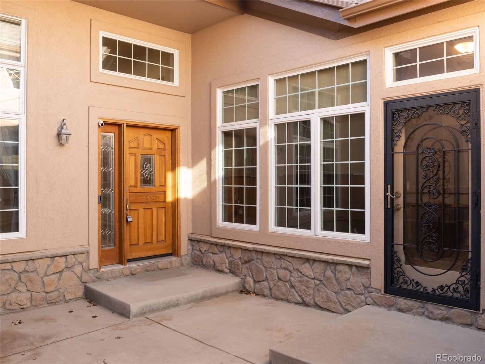 4940 West 107th Loop Westminster, CO 80031 - Photo 40 of 44 a front view of a house with a outdoor space