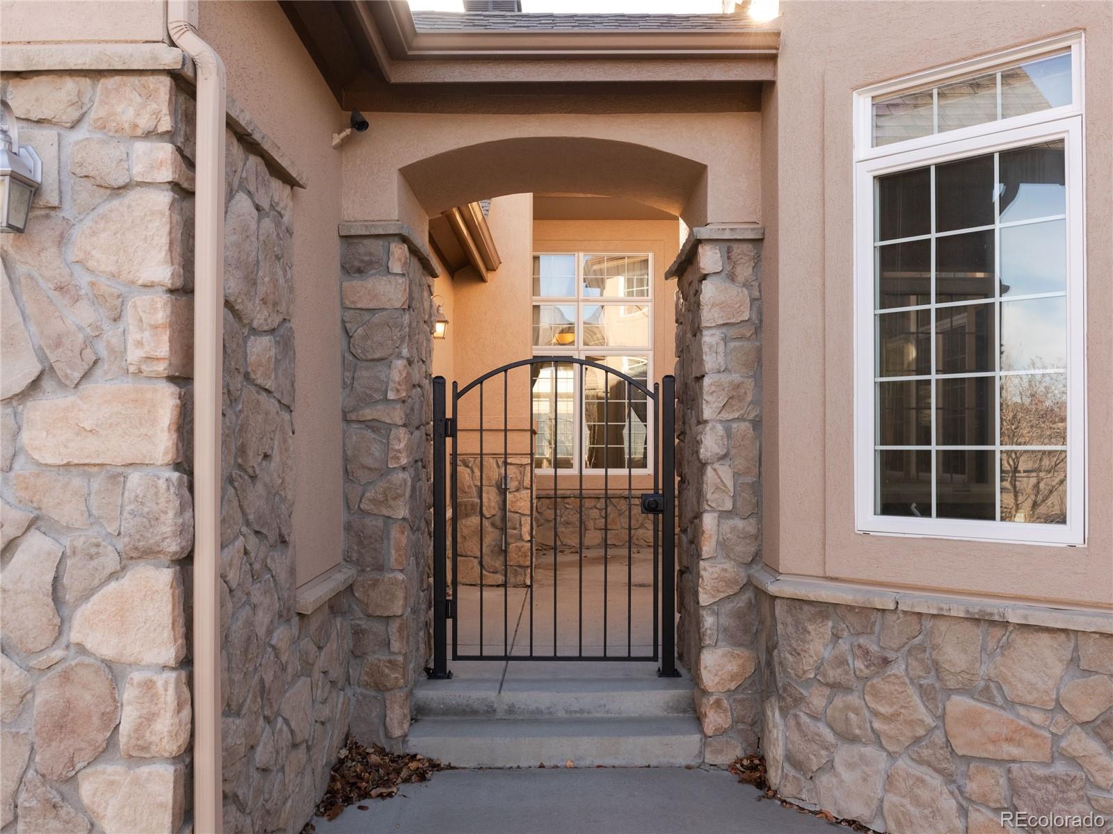 4940 West 107th Loop Westminster, CO 80031 - Photo 41 of 44 a front view of a house with a large window
