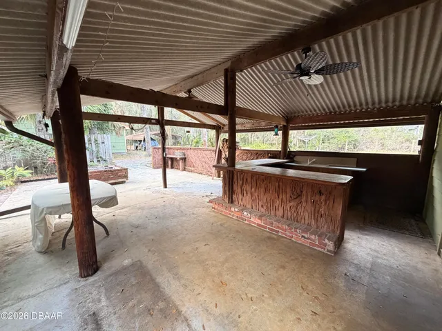 a view of a chairs with wooden fence