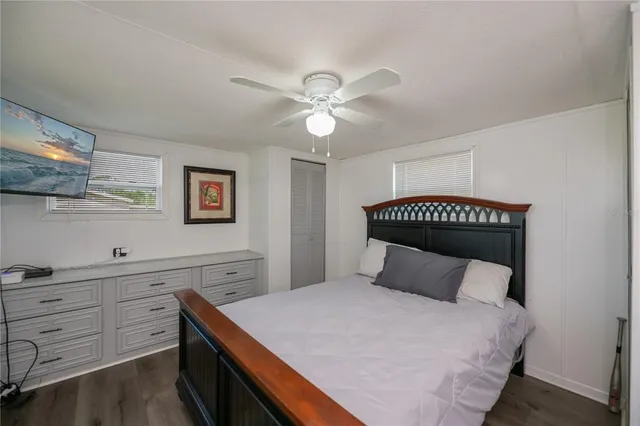 a bedroom with a bed and a table