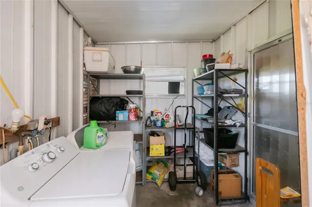 a room filled with furniture and a book shelf
