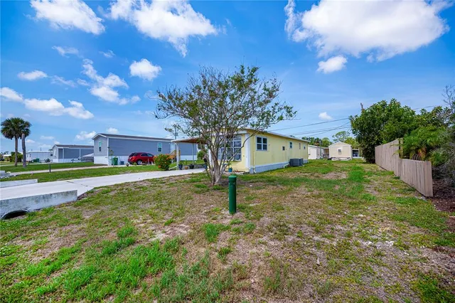 aerial view of a house with a yard