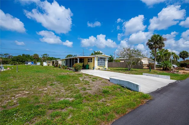 front view of a house with a big yard