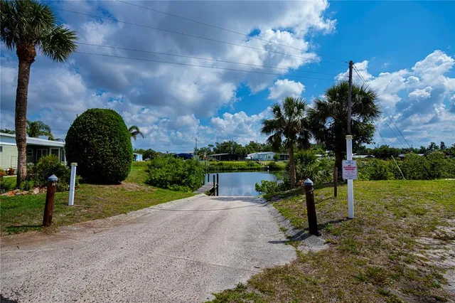 an aerial view of residential building and lake