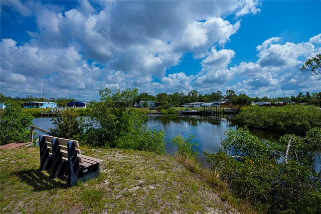 an aerial view of a houses with a yard