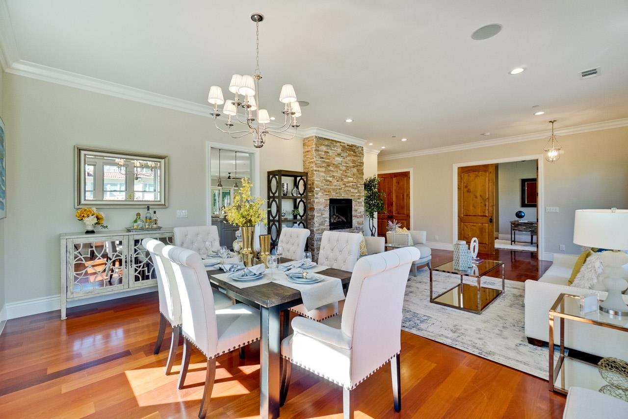 1650 Crestview Drive Los Altos, CA 94024 - Photo 13 of 50 a view of a dining room with furniture a chandelier and wooden floor