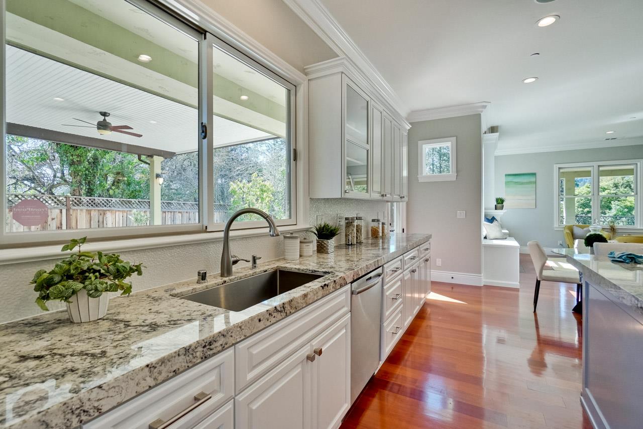 1650 Crestview Drive Los Altos, CA 94024 - Photo 22 of 50 a large kitchen with kitchen island a large window in it
