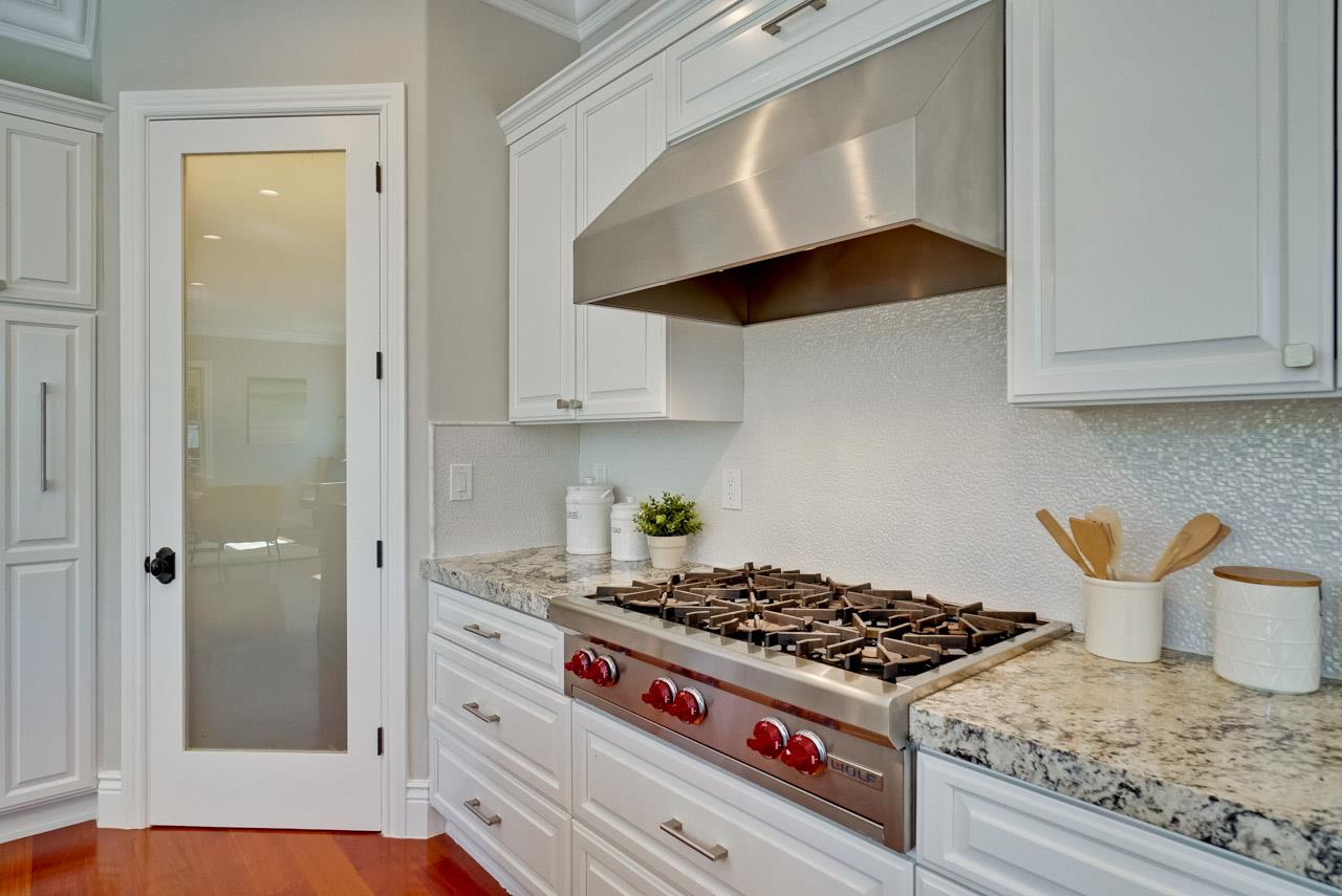 1650 Crestview Drive Los Altos, CA 94024 - Photo 24 of 50 a kitchen with white cabinets and appliances