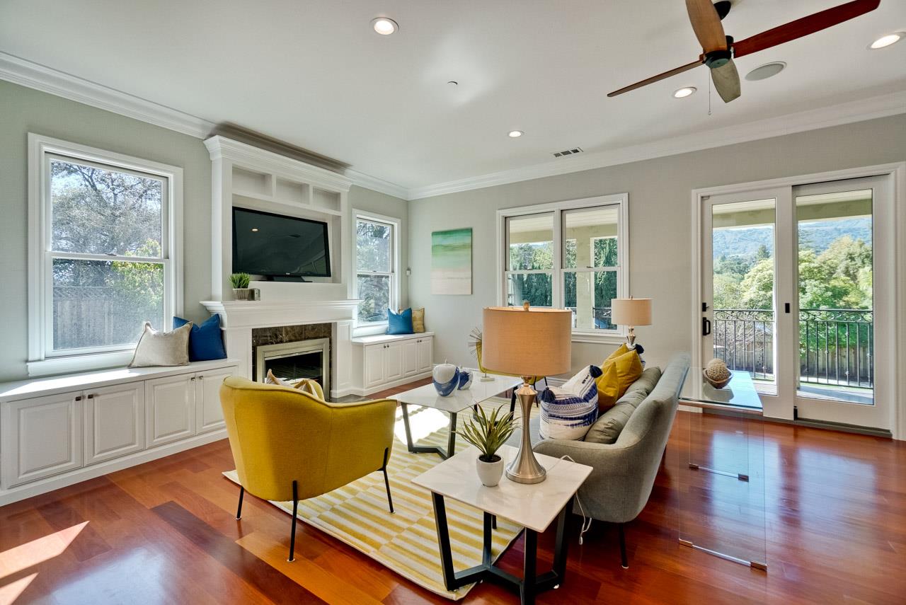 1650 Crestview Drive Los Altos, CA 94024 - Photo 27 of 50 a living room with fireplace furniture and a flat screen tv