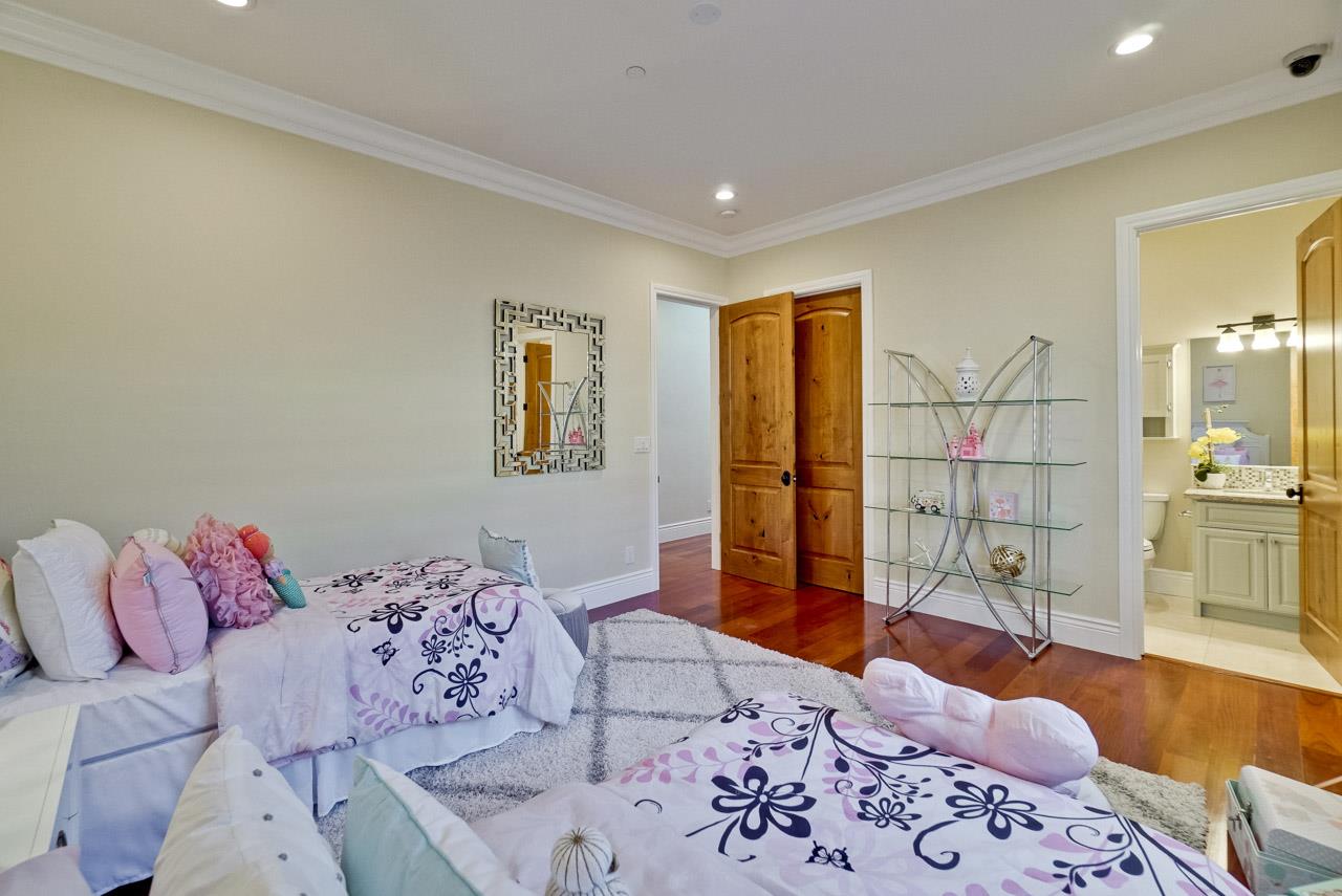 1650 Crestview Drive Los Altos, CA 94024 - Photo 31 of 50 a bedroom with a bed and wooden floor