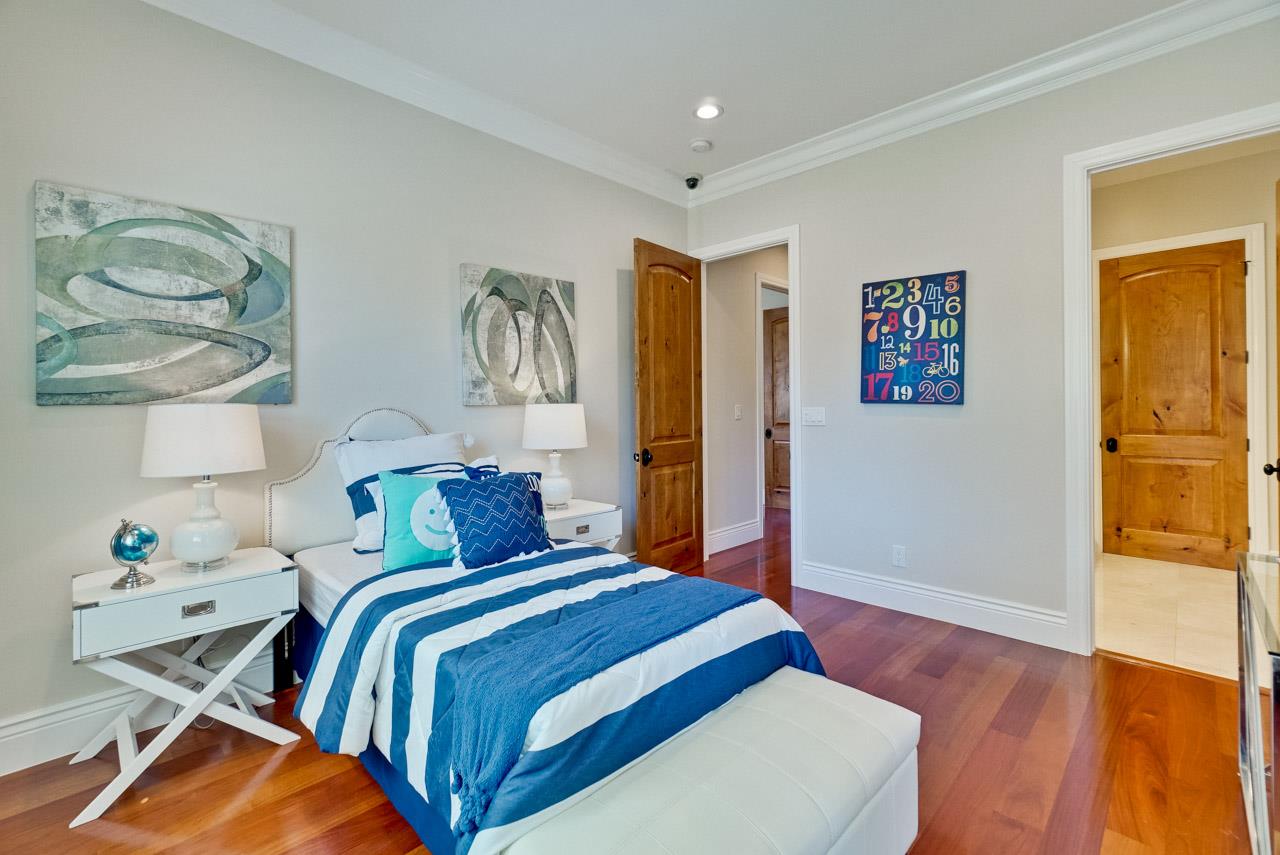 1650 Crestview Drive Los Altos, CA 94024 - Photo 35 of 50 a bedroom with a bed and painting on the wall