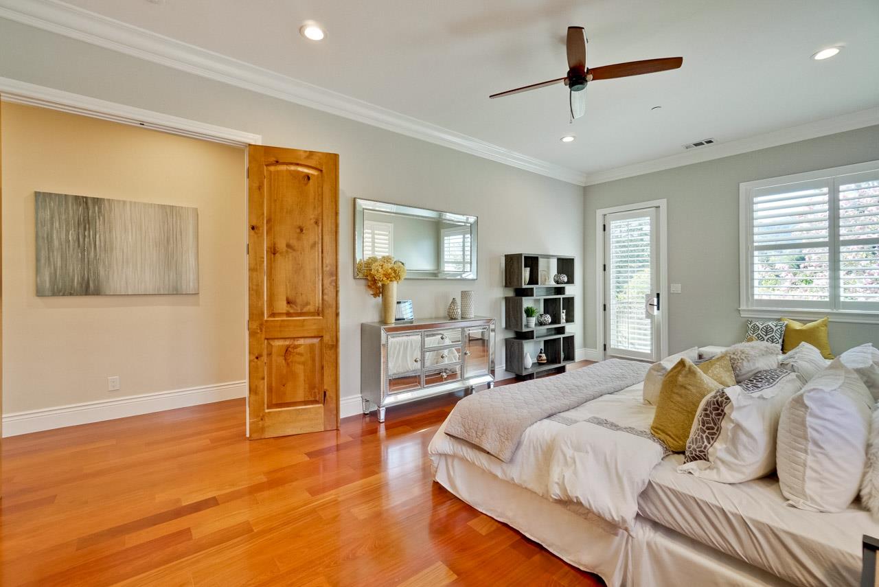 1650 Crestview Drive Los Altos, CA 94024 - Photo 40 of 50 a spacious bedroom with a bed and a walk in closet