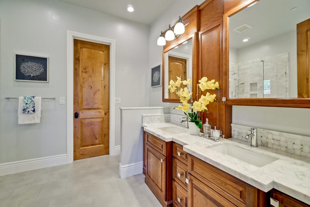 1650 Crestview Drive Los Altos, CA 94024 - Photo 41 of 50 a bathroom with a granite countertop sink and a mirror