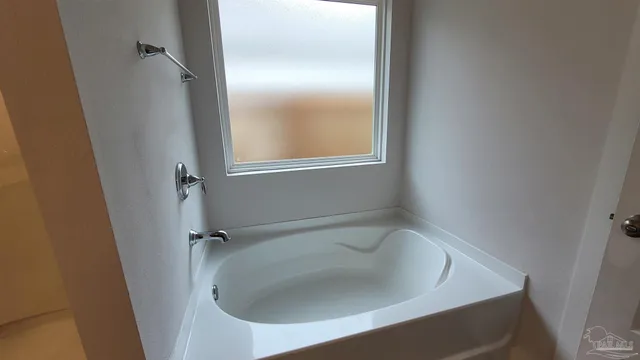 a bathroom with a sink and tub