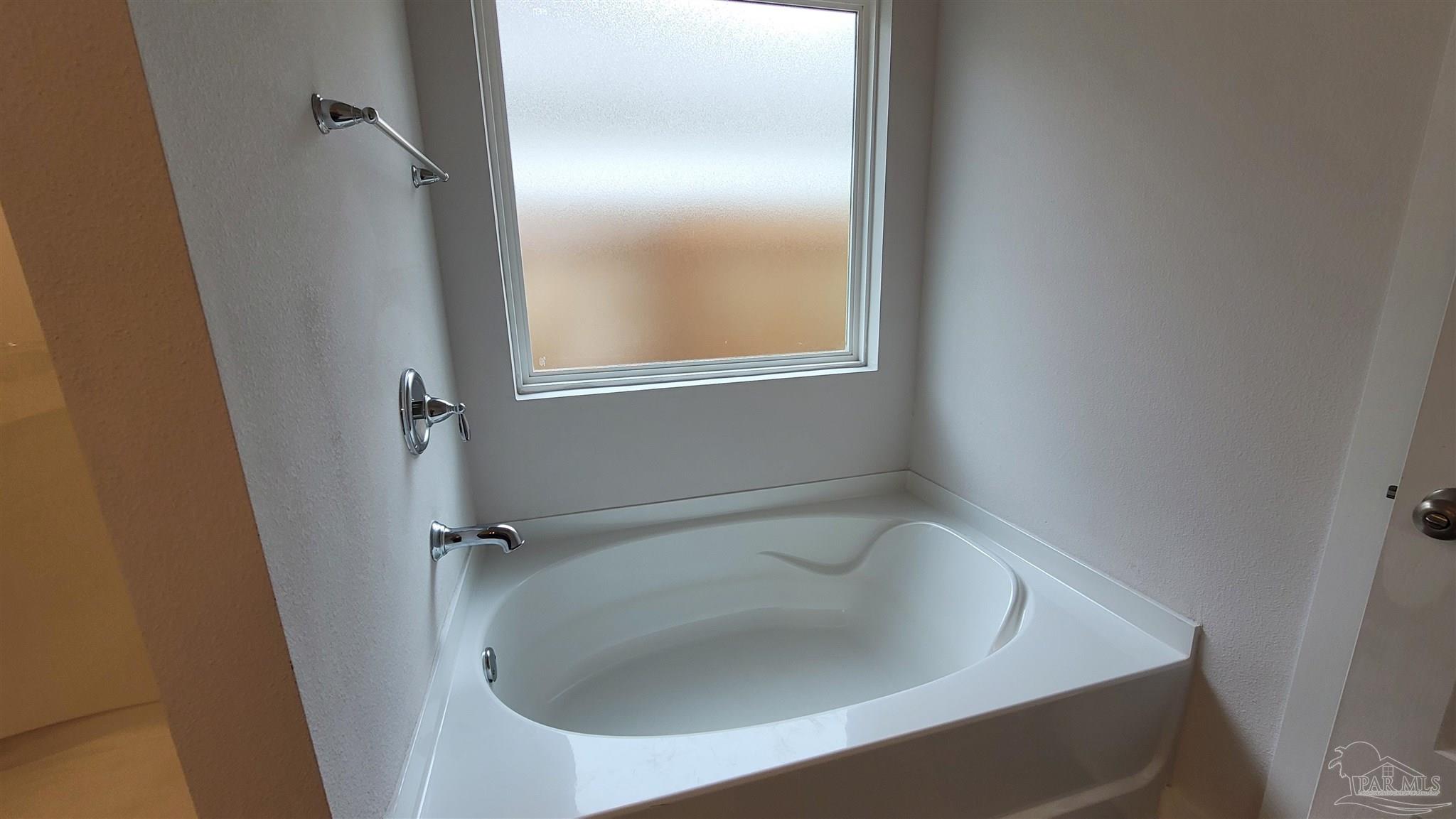 5748 Conley Court Pace, FL 32571 - Photo 13 of 22 a bathroom with a sink and tub