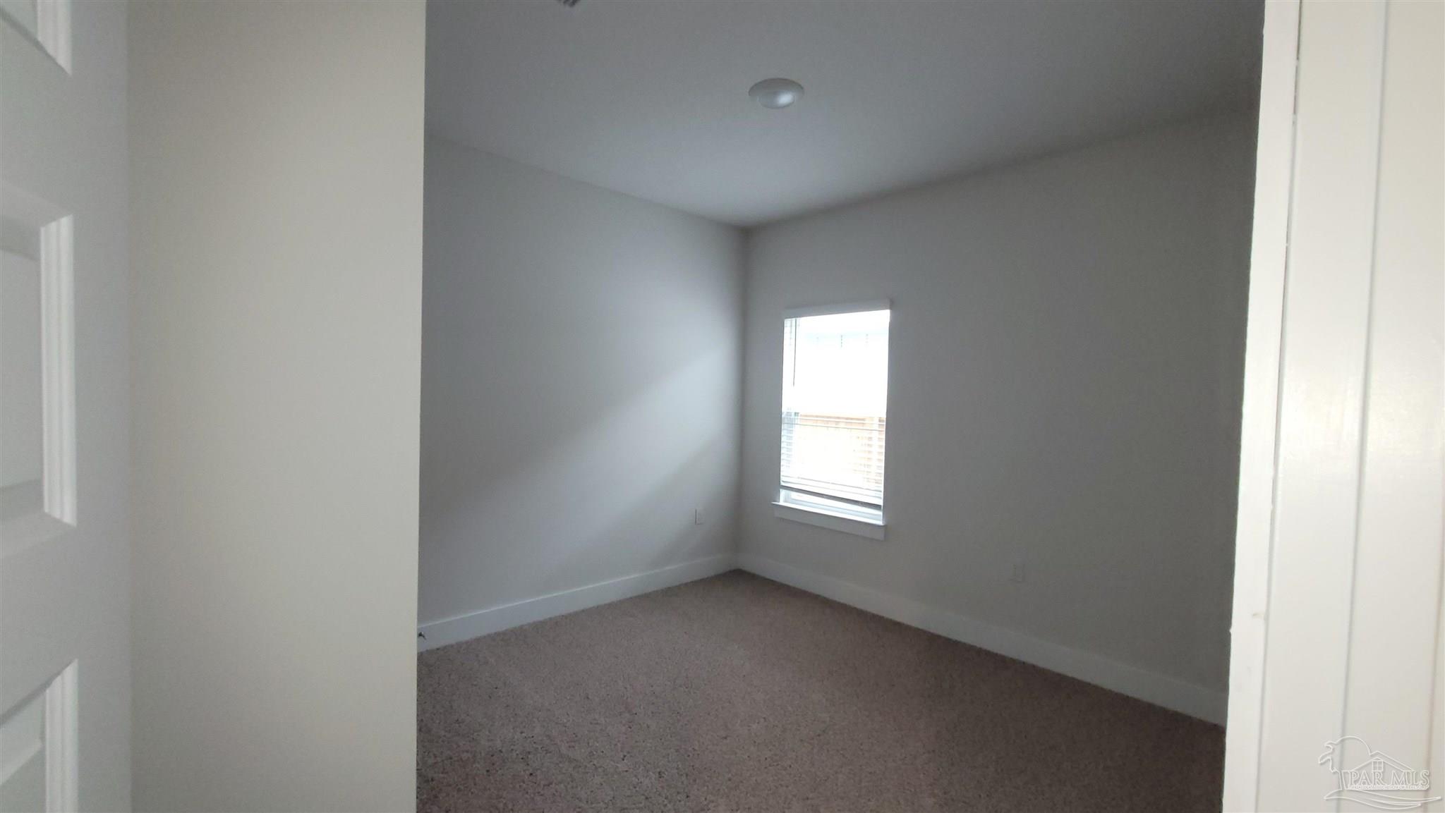5748 Conley Court Pace, FL 32571 - Photo 20 of 22 a view of an empty room with a window