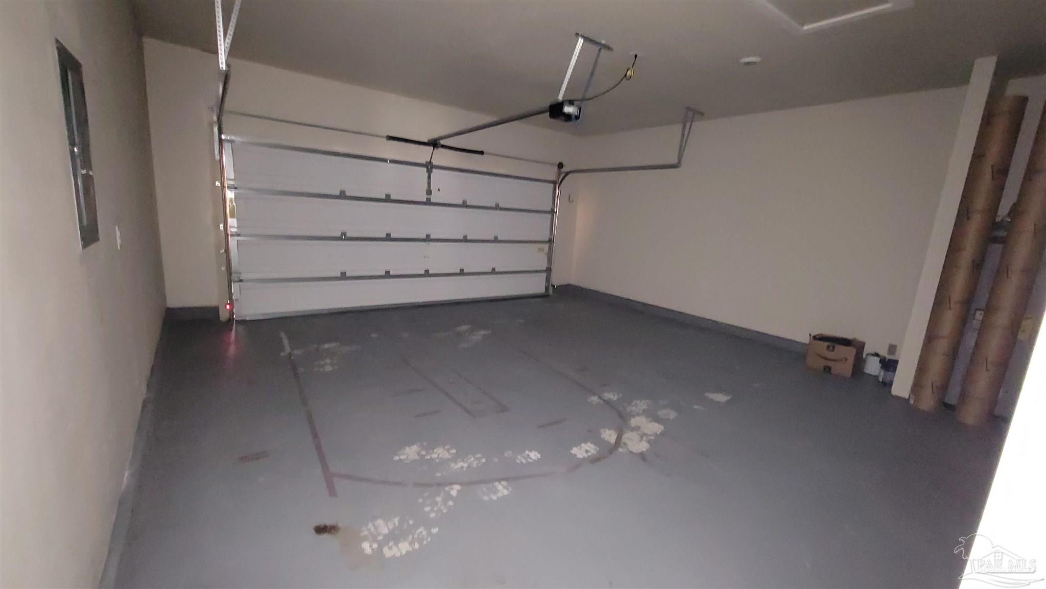 5748 Conley Court Pace, FL 32571 - Photo 21 of 22 a view of a room with racks on the wall