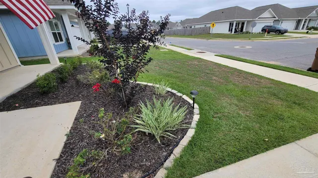 a view of a house with a big yard