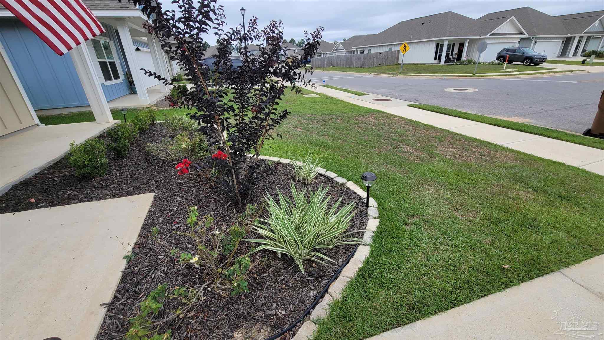 5748 Conley Court Pace, FL 32571 - Photo 3 of 22 a view of a house with a big yard
