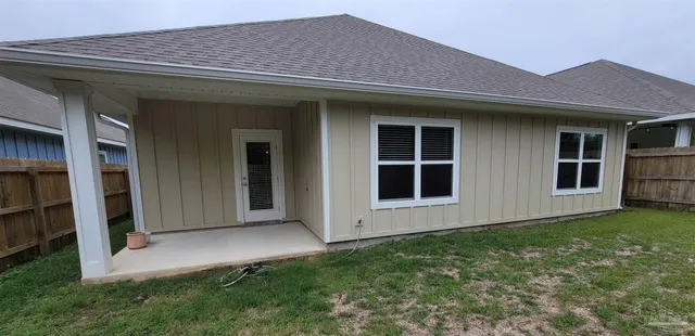 a view of backyard with potted plants