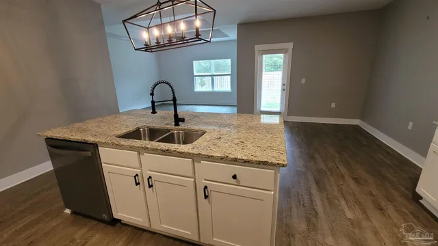 a sink with wooden floor