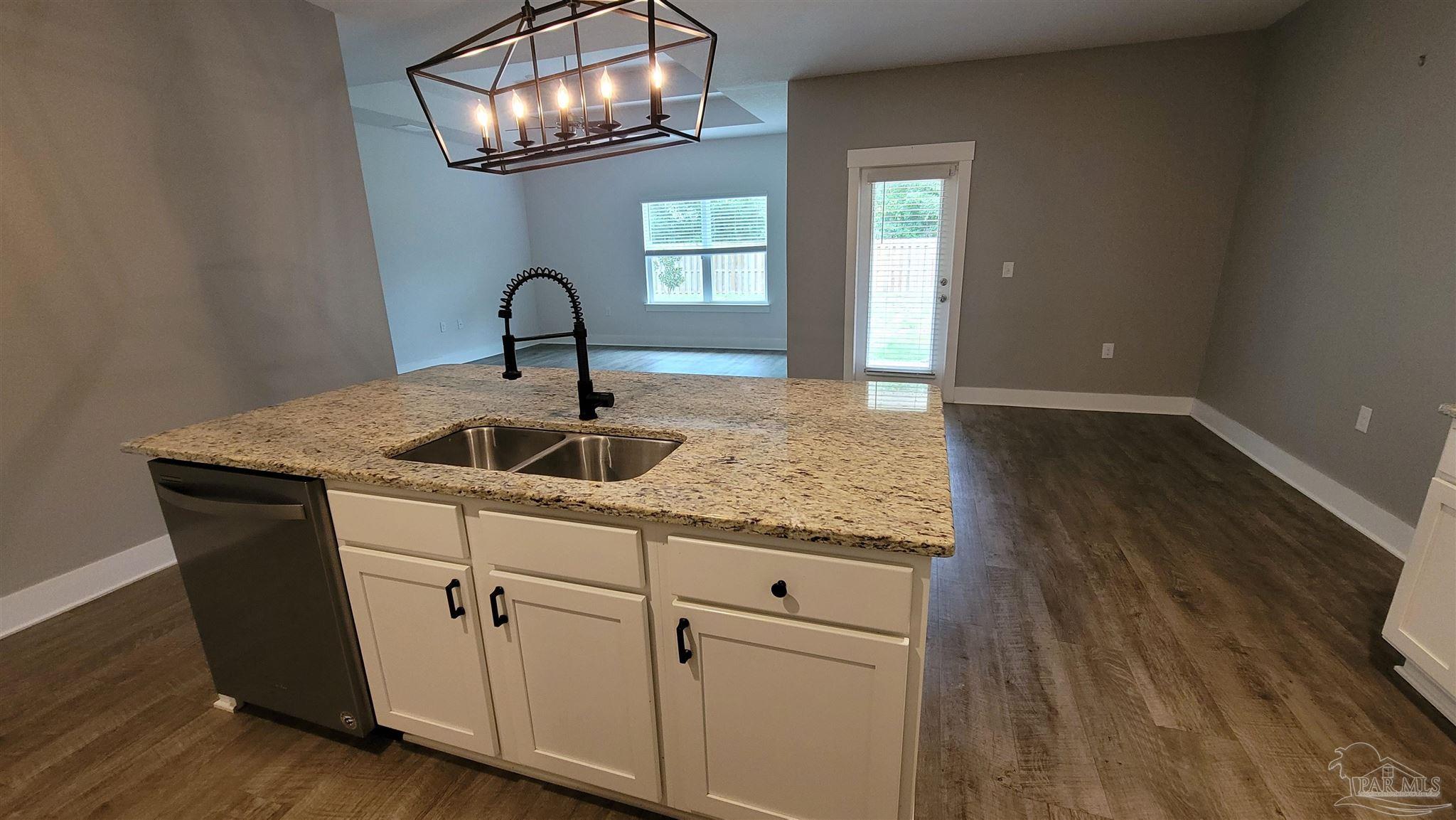 5748 Conley Court Pace, FL 32571 - Photo 9 of 22 a sink with wooden floor