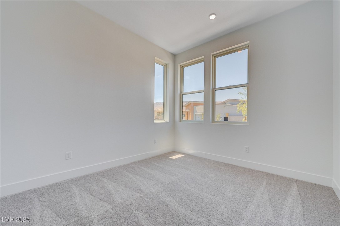4992 Ascent Point Las Vegas, NV 89135 - Photo 40 of 61 Spare room with carpet and baseboards