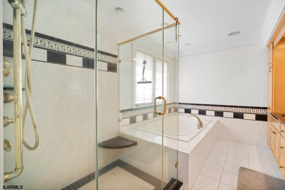 20 Heald Road Brigantine, NJ 08203 - Photo 27 of 66 a bathroom with a tub and a shower