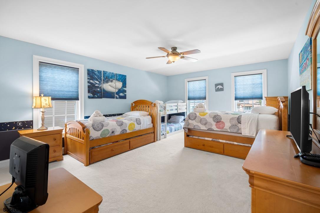 20 Heald Road Brigantine, NJ 08203 - Photo 31 of 66 a bedroom with furniture and a flat screen tv