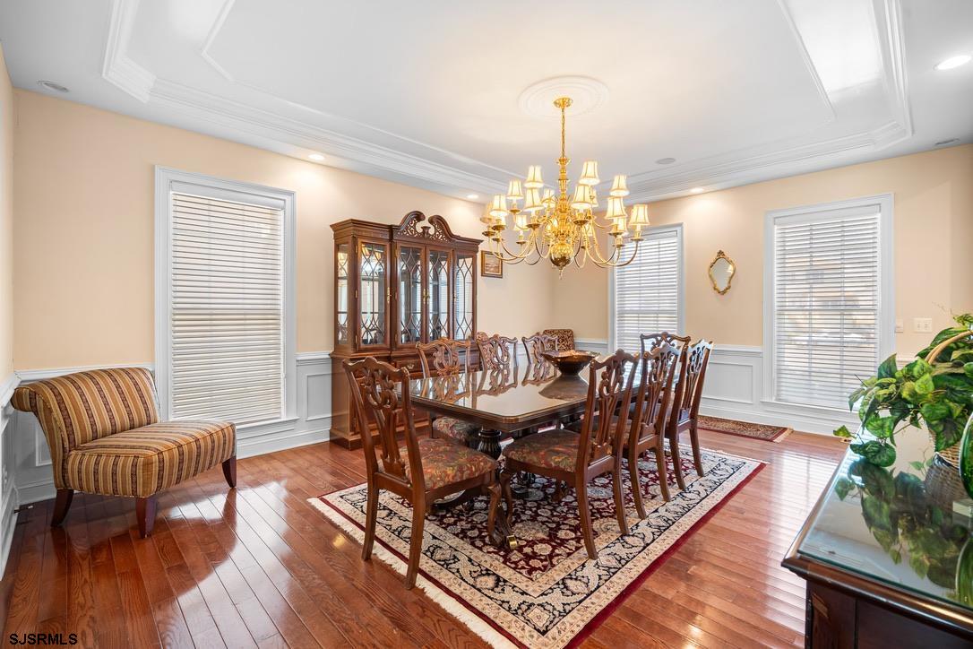 20 Heald Road Brigantine, NJ 08203 - Photo 8 of 66 a view of a dining room with furniture a chandelier and wooden floor