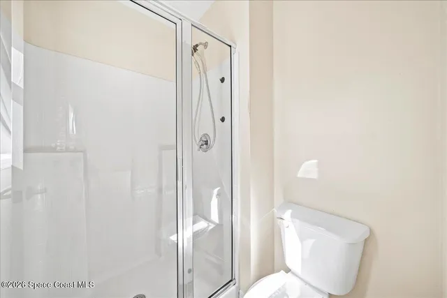 a spacious bathroom with a double vanity sink a mirror and a bathtub