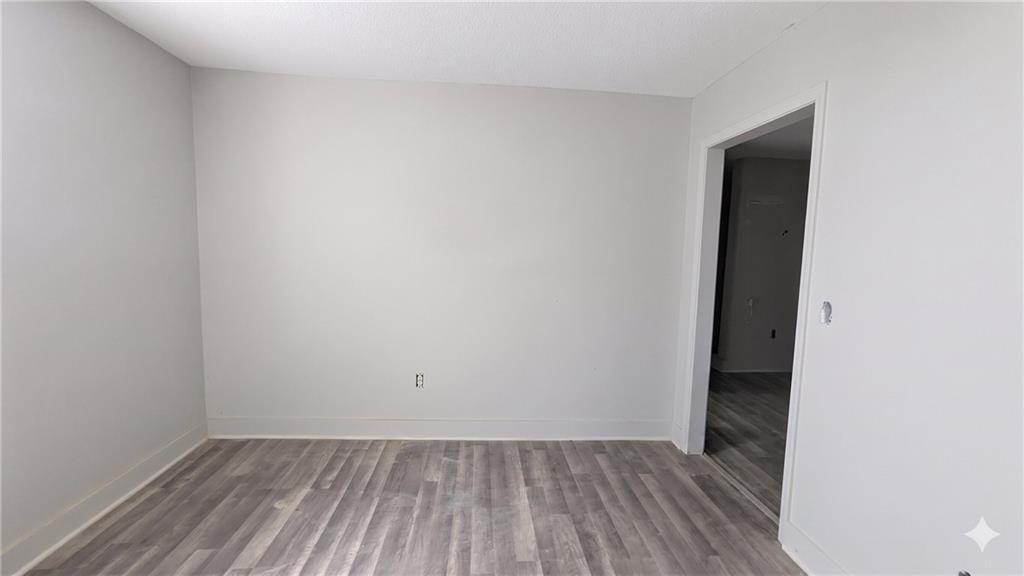 665 Lexington Avenue Southwest Atlanta, GA 30310 - Photo 30 of 33 a view of an empty room with wooden floor and closet