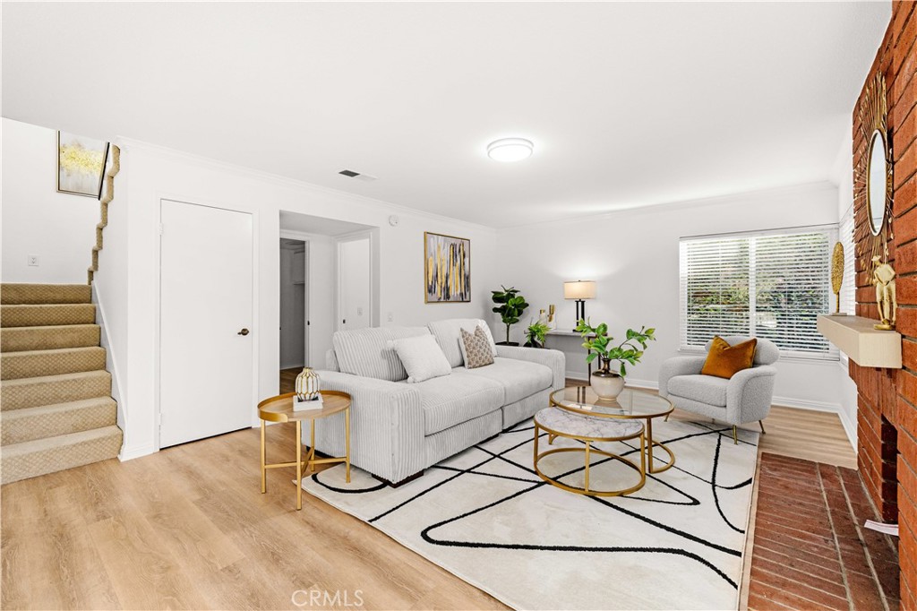 19 Alameda Irvine, CA 92620 - Photo 14 of 59 a living room with furniture and wooden floor