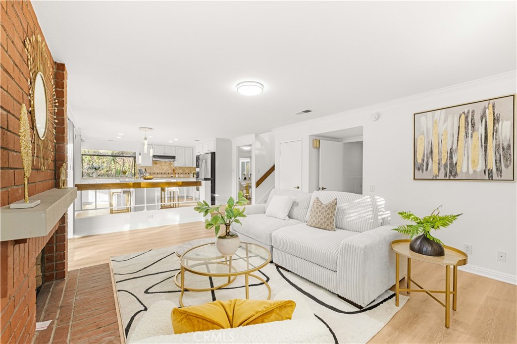 19 Alameda Irvine, CA 92620 - Photo 15 of 59 a living room with furniture and a floor to ceiling window
